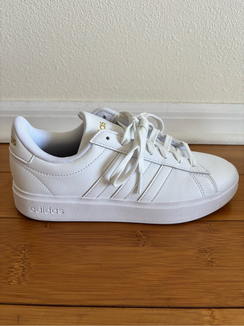 adidas White Low-Top Platform Sneakers with Gold Accents